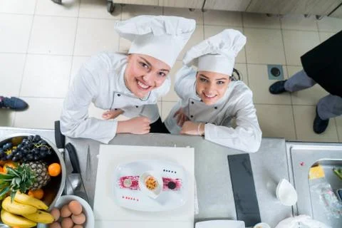 Chef Cooking, Cutting and preparing next plate Stock Photos
