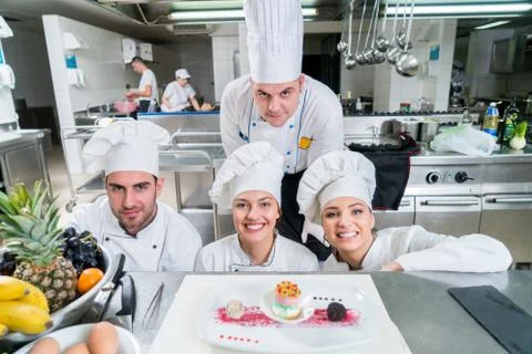 Chef Cooking, Cutting and preparing next plate Stock Photos