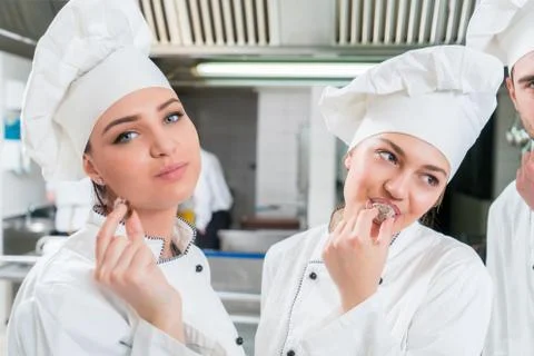 Chef Cooking, Cutting and preparing next plate Stock Photos