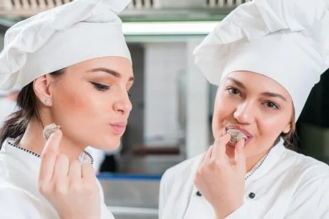 Chef Cooking, Cutting and preparing next plate Stock Photos