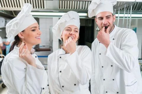 Chef Cooking, Cutting and preparing next plate Stock Photos