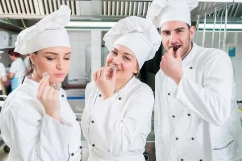 Chef Cooking, Cutting and preparing next plate Stock Photos