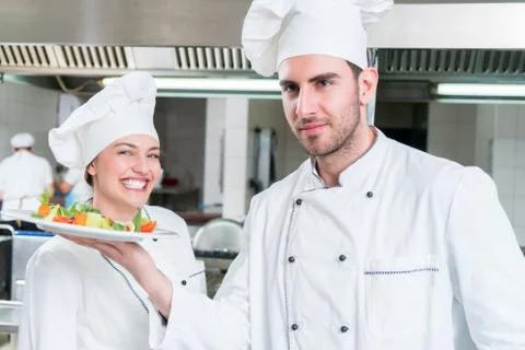 Chef Cooking, Cutting and preparing next plate Stock Photos