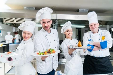 Chef Cooking, Cutting and preparing next plate Stock Photos