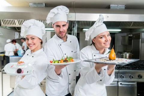 Chef Cooking, Cutting and preparing next plate Stock Photos