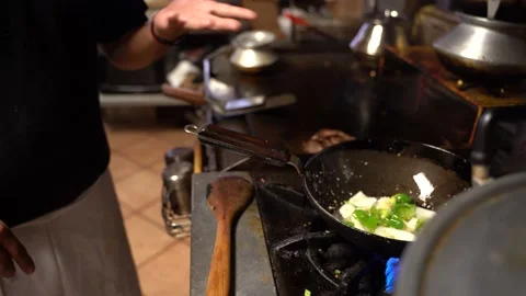 Chef cooking a dish Stock Footage 142724427