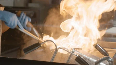 Chef cooking with fire in wok Stock Footage 124624621
