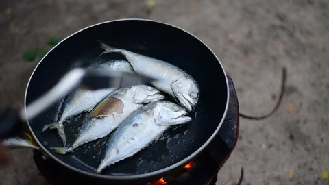 Chef cooking fish fried in pan. Stock Footage 128697252