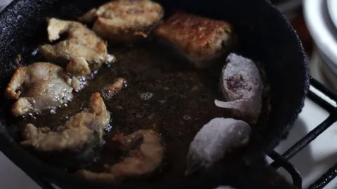 Chef is cooking fish in a frying pan until golden brown Vídeos de archivo 74281961