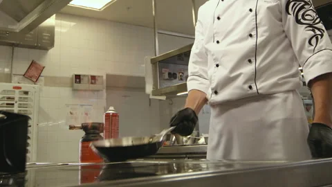 Chef Cooking with Flaming Pan Stock Footage 318345674