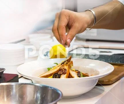 Chef cooking food in the kitchen, Chef preparing food Stock Photos