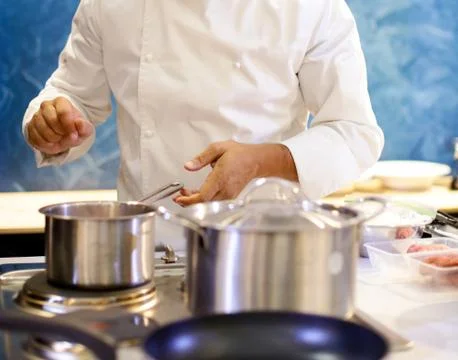 Chef cooking food in the kitchen, Chef preparing food Stock Photos