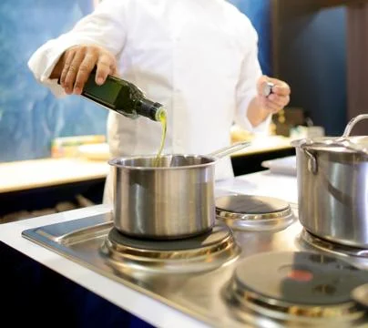 Chef cooking food in the kitchen, Chef preparing food Stock Photos