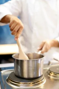Chef cooking food in the kitchen, Chef preparing food Stock Photos