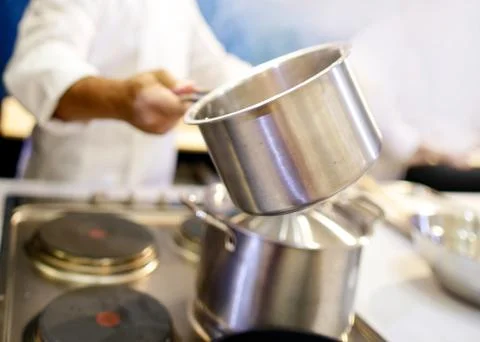 Chef cooking food in the kitchen, Chef preparing food Stock Photos
