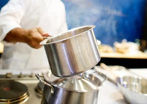 Chef cooking food in the kitchen, Chef preparing food Stock Photos