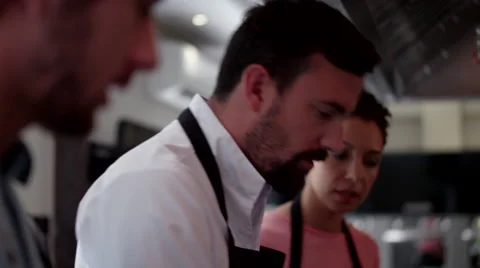 Chef cooking food at kitchen. Stock Footage 64116212