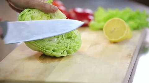 Chef cooking fresh crispy iceberg salad slowmotion Stock Footage 68089837