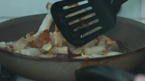 Chef Cooking Fresh Sliced Pork Belly Pieces in a Hot Frying Pan on the Stove Stock Footage 339658938
