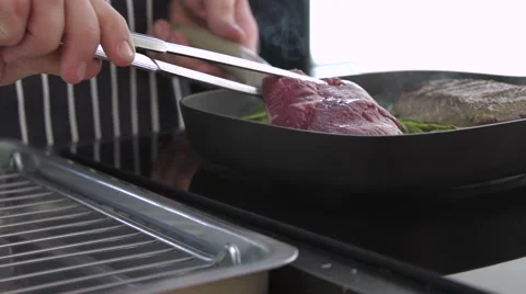 Chef cooking  fresh steaks Stock Footage 56868056