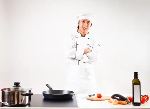 Chef Cooking In His Kitchen Stockfoto's