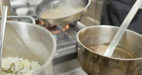 Chef Cooking in Kitchen Frying Pan Vegetable Preparing Hand Close Up  Vídeo Stock 138143802
