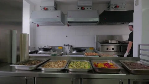 Chef cooking in kitchen in restaurant. Restaurant kitchen, chef cooking food. Stock Footage 72139118