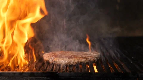 Chef cooking meat for burger in slow motion. Grilling Hamburger Meat in Stock Footage 124232479