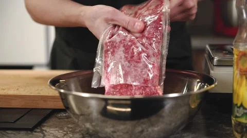 Chef is cooking meat stuffing for dumplings. Stock Footage 146823115