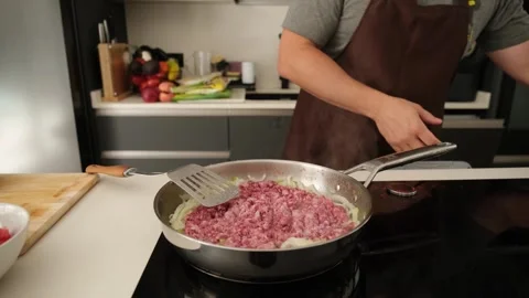 Chef cooking minced meat with onion and spices Video stock 346525931