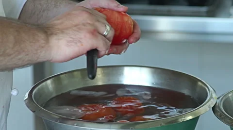 Chef cooking minced tomatoes in boiling water in a pot. 스톡 동영상 48659358