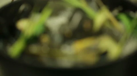 Chef cooking mussels in a pot with different types of herbs in oriental style Stock Footage 68632078