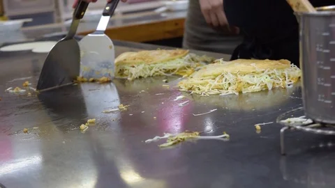 Chef cooking Okonomiyaki Stock Footage 102002155