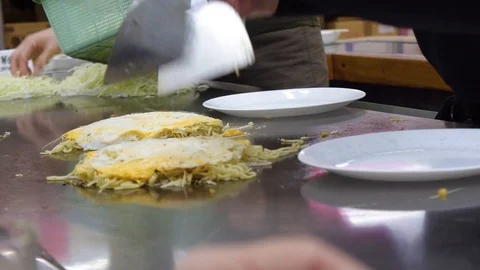 Chef cooking Okonomiyaki Stock Footage 102003580