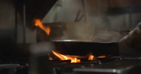 Chef cooking over fire 4K Stock Footage 157283229