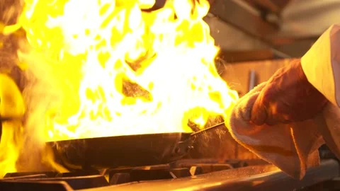 Chef cooking over fire 4K Stock Footage 158036405