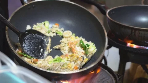 Chef cooking Pad Thai stir-fried rice noodles with shrimp Stock Footage 74727571