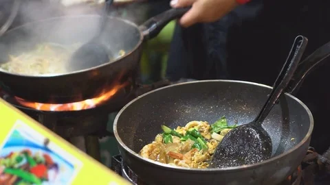 Chef cooking Pad Thai stir-fried rice noodles with shrimp Stock Footage 74727775