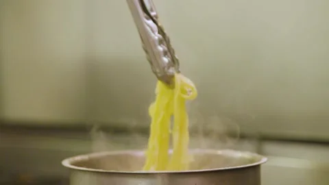 Chef cooking pasta in pot, boiling water Stock Footage 157282907