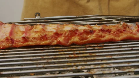 Chef cooking pork and beef ribs on grill with fire close-up. Traditional spanish Stock Footage 266756193