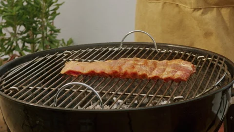 Chef cooking pork and beef ribs on grill with fire close-up. Traditional spanish Stock Footage 295382291