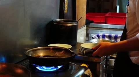 Chef cooking in a restaurant kitchen, Hong Kong, China. Stock Footage 52764663