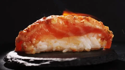 Chef cooking Sashimi Nigiri Platter with flambe fire, japanese sushi restaurant Stock Footage 285178070