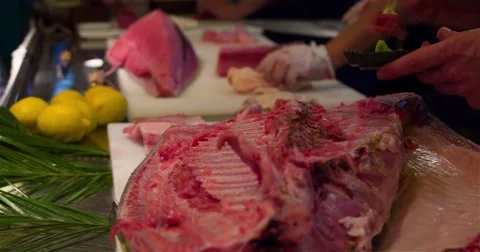 Chef cooking scraping spoon raw bluefin tuna fish 4k video close up Stock Footage 67487724