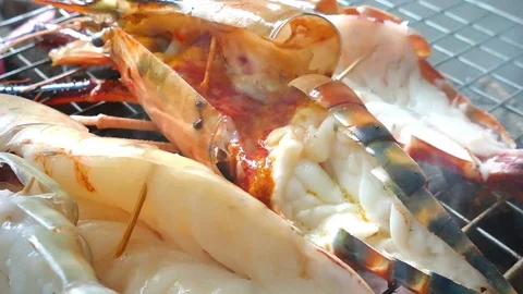 Chef Cooking seafood on barbeque grill. Grilled Giant River Prawn Video stock 75559876