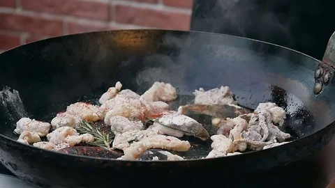 Chef is cooking seafood dish Vídeos de archivo 74944694