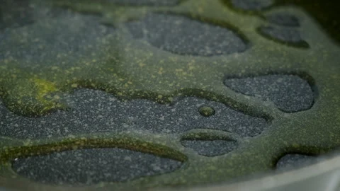 Chef cooking skillfully pouring olive oil into frying pan on kitchen. Stock Footage 312468923