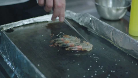 A Chef cooking some prawn Stock Footage 283013336