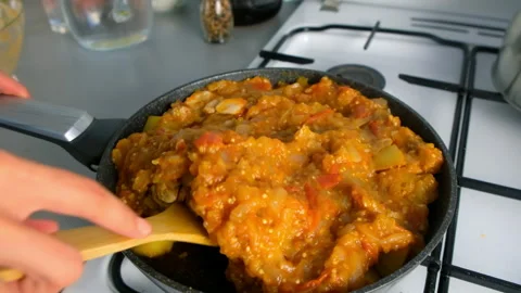 Chef cooking stew mixing vegetable sauce with chicken and potatoes on kitchen. Stock Footage 312469581