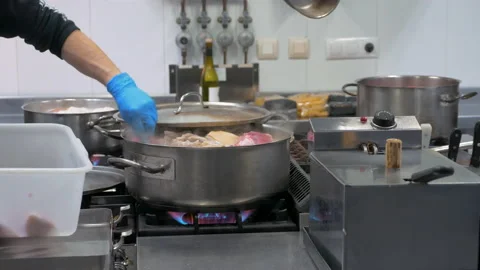 Chef cooking a traditional stew Stock Footage 148992045